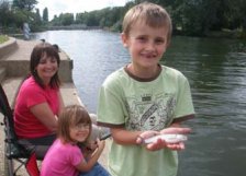 Family fishing on the River Thames in Reading